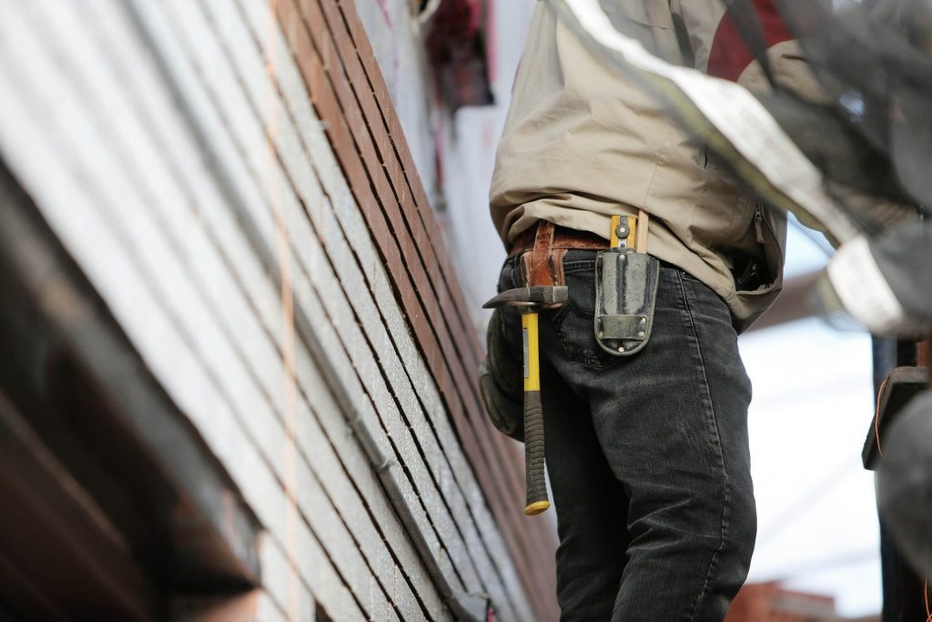 A figure wearing clothes that identify them as a construction worker.